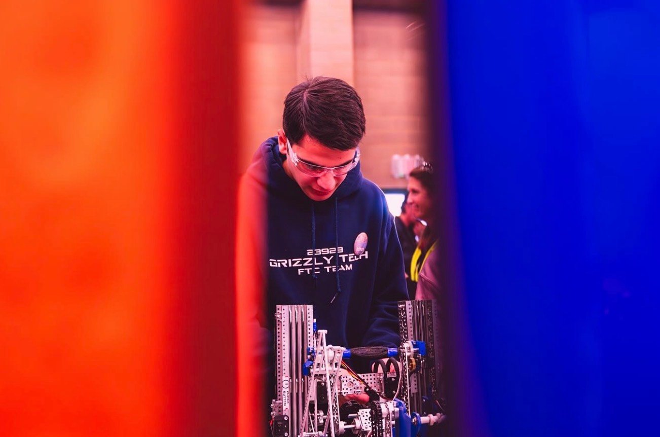 A Grizzly Tech team member working on the team's robot